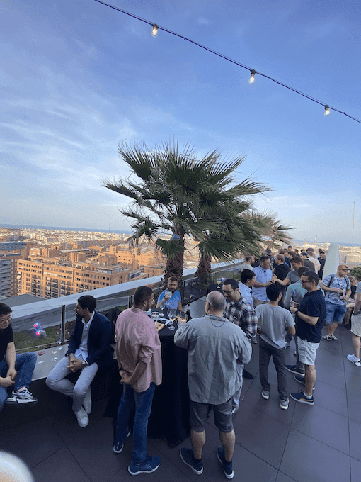 group of people attending a rooftop happy hour